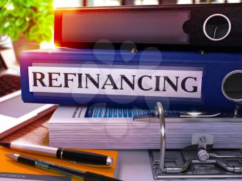 Refinancing - Blue Ring Binder on Office Desktop with Office Supplies and Modern Laptop. Refinancing Business Concept on Blurred Background. Refinancing - Toned Illustration. 3D Render.