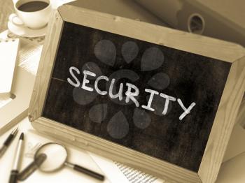 Security Concept Hand Drawn on Chalkboard on Working Table Background. Blurred Background. Toned Image. 3D Render.