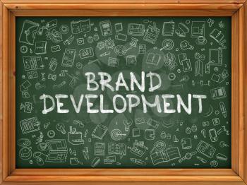 Brand Development - Hand Drawn on Chalkboard. Brand Development with Doodle Icons Around.