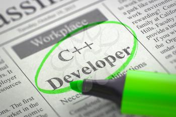 A Newspaper Column in the Classifieds with the Vacancy of C Developer, Circled with a Green Marker. Blurred Image. Selective focus. Job Search Concept. 3D Illustration.