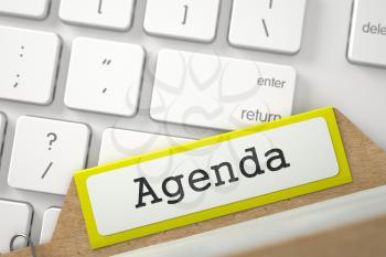 Agenda Concept. Word on Yellow Folder Register of Card Index. Closeup View. Blurred Image. 3D Rendering.