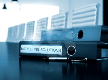 Marketing Solutions - Illustration. Ring Binder with Inscription Marketing Solutions on Black Office Desktop. Marketing Solutions. Business Illustration on Toned Background. 3D Render.