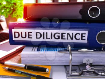 Due Diligence - Blue Office Folder on Background of Working Table with Stationery and Laptop. Due Diligence Business Concept on Blurred Background. Due Diligence Toned Image. 3D.
