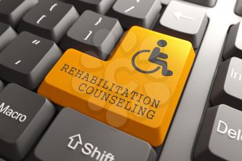 Rehabilitation Counseling Words with Disabled Icon on Orange Button of Black Modern Computer Keyboard.