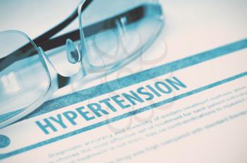 Diagnosis - Hypertension. Medical Concept with Blurred Text and Glasses on Blue Background. Selective Focus. 3D Rendering.