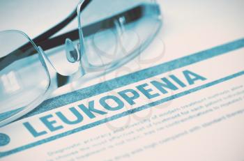 Leukopenia - Medical Concept with Blurred Text and Glasses on Blue Background. Selective Focus. 3D Rendering.