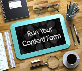 Run Your Content Farm Handwritten on Mint Small Chalkboard. Top View of Wooden Office Desk with a Lot of Business and Office Supplies on It. Small Chalkboard with Run Your Content Farm. 3d Rendering.