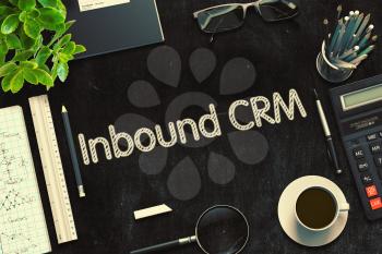 Inbound CRM - Black Chalkboard with Hand Drawn Text and Stationery. Top View. 3d Rendering. Toned Image.