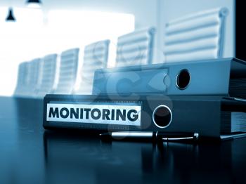 Monitoring - Folder on Wooden Desktop. Office Folder with Inscription Monitoring on Black Desktop. Monitoring. Illustration on Blurred Background. 3D Render.