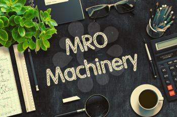 MRO Machinery - Text on Black Chalkboard.3d Rendering. Toned Illustration.