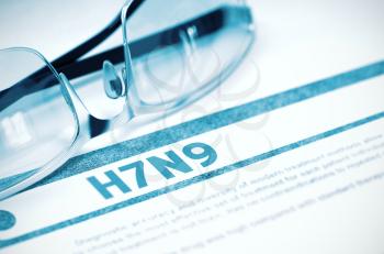 Diagnosis - H7N9 - Virus. Medicine Concept with Blurred Text and Glasses on Blue Background. Selective Focus. 3D Rendering.