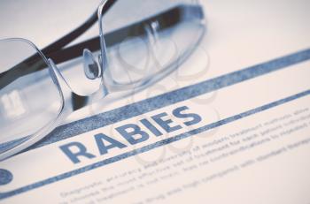 Diagnosis - Rabies. Medical Concept on Blue Background with Blurred Text and Specs. Selective Focus. 3D Rendering.