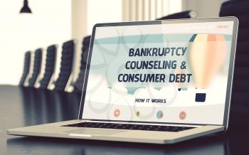 Modern Meeting Hall with Laptop Showing Landing Page with Text Bankruptcy Counseling and Consumer Debt. Closeup View. Blurred Image with Selective focus. 3D.