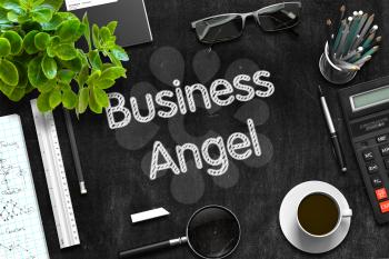 Black Chalkboard with Handwritten Business Concept - Business Angel - on Black Office Desk and Other Office Supplies Around. Top View. 3d Rendering. 