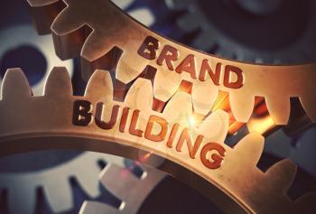 Brand Building on the Mechanism of Golden Gears with Glow Effect. Brand Building Golden Cog Gears. 3D Rendering.