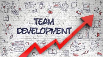 Team Development - Development Concept. Inscription on the White Brick Wall with Hand Drawn Icons Around. Team Development - Improvement Concept with Hand Drawn Icons Around on Brick Wall Background. 