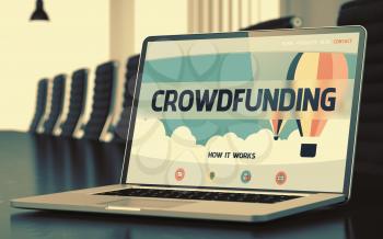 Modern Conference Room with Laptop Showing Landing Page with Text Crowdfunding. Closeup View. Toned Image with Selective Focus. 3D.