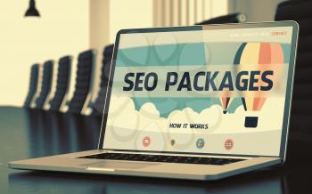 SEO Packages - Landing Page with Inscription on Laptop Screen on Background of Comfortable Meeting Room in Modern Office. Closeup View. Blurred. Toned Image. 3D Render.