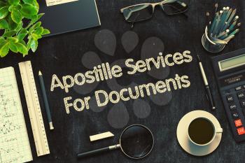 Apostille Services For Documents - Black Chalkboard with Hand Drawn Text and Stationery. Top View. 3d Rendering. Toned Illustration.