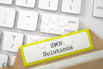 Yellow Index Card with Inscription SMB Solutions Lays on Modern Keyboard. Closeup View. Blurred Image. 3D Rendering.