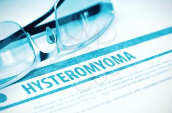 Hysteromyoma - Medical Concept with Blurred Text and Eyeglasses on Blue Background. Selective Focus. 3D Rendering.