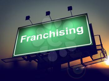 Franchising - Green Billboard on the Rising Sun Background. .