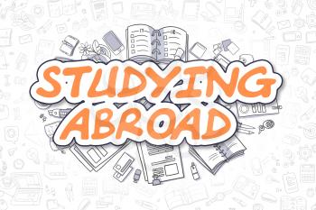 Studying Abroad - Sketch Business Illustration. Orange Hand Drawn Word Studying Abroad Surrounded by Stationery. Doodle Design Elements. 