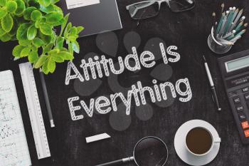 Attitude Is Everything - Black Chalkboard with Hand Drawn Text and Stationery. Top View. 3d Rendering. Toned Image.