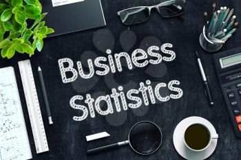 Business Statistics on Black Chalkboard. 3d Rendering. Toned Image.