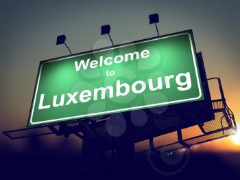 Welcome to Luxembourg - Green Billboard on the Rising Sun Background.