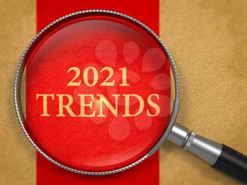 2021 Trends through Magnifying Glass on Old Paper with Red Vertical Line Background.