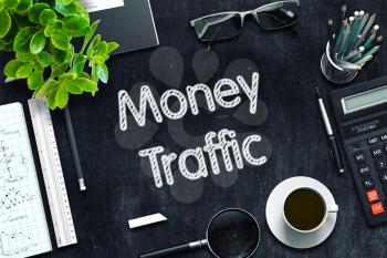 Money Traffic - Black Chalkboard with Hand Drawn Text and Stationery. Top View. 3d Rendering. Toned Illustration.