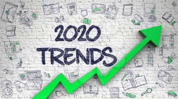 Brick Wall with 2020 Trends Inscription and Green Arrow. Business Concept. 2020 Trends - Development Concept. Inscription on White Brickwall with Doodle Icons Around.