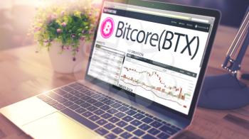 Modern Workplace with Laptop showing Website with Exchange Marketplace of Bitcore - BTX. Cryptocurrency Concept. Toned Image with Selective Focus. 3D .