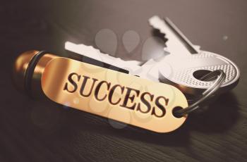 Keys to Succes - Concept on Golden Keychain over Black Wooden Background. Closeup View, Selective Focus, 3D Render. Toned Image.