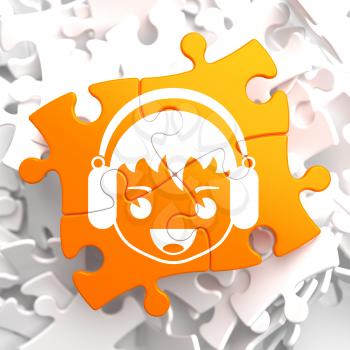 Happy Boy with Headphones Icon on Orange Puzzle. Sound, Music Concept.