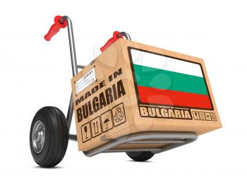 Cardboard Box with Flag of Bulgaria and Made in Bulgaria Slogan on Hand Truck White Background. Free Shipping Concept.