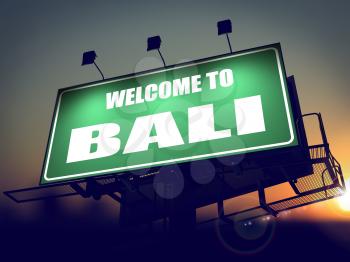 Welcome to Bali - Green Billboard on the Rising Sun Background.