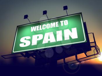 Welcome to Spain - Green Billboard on the Rising Sun Background.