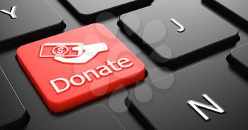 Donate with Money in the Hand Icon - Red Button on Black Computer Keyboard.