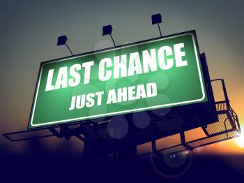 Last Chance Just Ahead - Green Billboard on the Rising Sun Background.