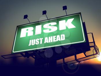 Risk Just Ahead - Green Billboard on the Rising Sun Background.
