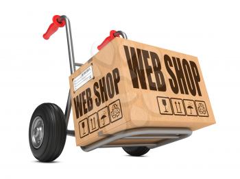 Cardboard Box with Web Shop Slogan on Hand Truck White Background.