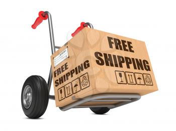 Cardboard Box with Free Shipping Slogan on Hand Truck White Background.