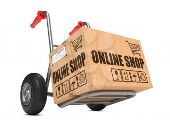 Cardboard Box with Online Shop Slogan on Hand Truck White Background.