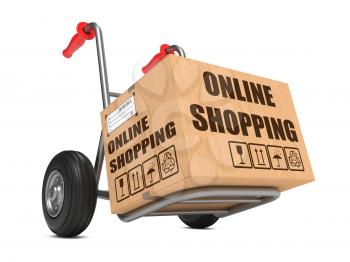 Cardboard Box with Online Shopping Slogan on Hand Truck White Background.