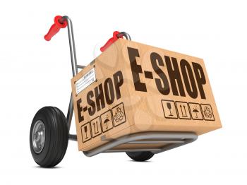 Cardboard Box with E-Shop Slogan on Hand Truck White Background.