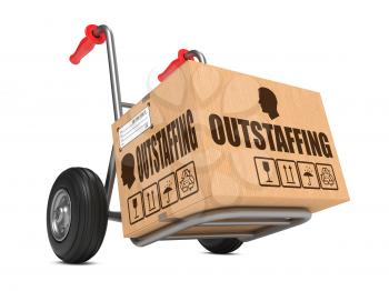 Outstaffing - Cardboard Box on Hand Truck Isolated on White Background.