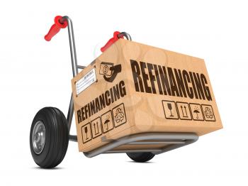 Refinancing - Cardboard Box on Hand Truck Isolated on White Background.