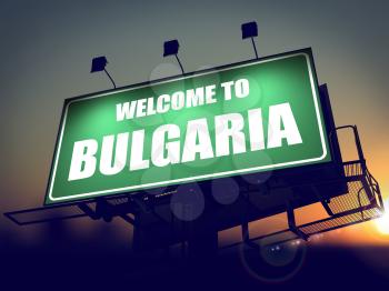 Welcome to Bulgaria - Green Billboard on the Rising Sun Background.